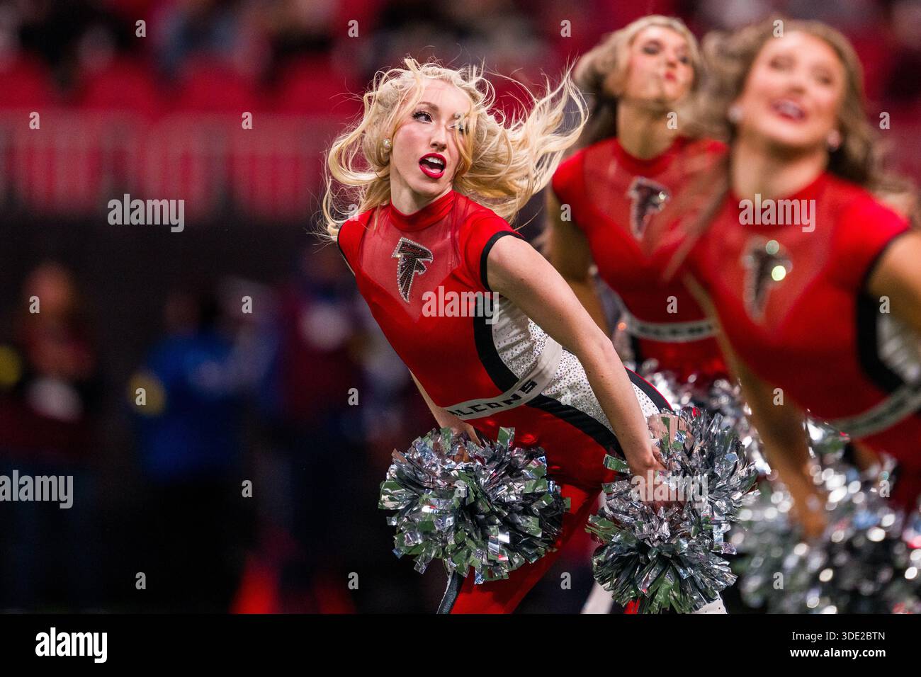 An Atlanta Falcons cheerleader performs before an NFL football game ...