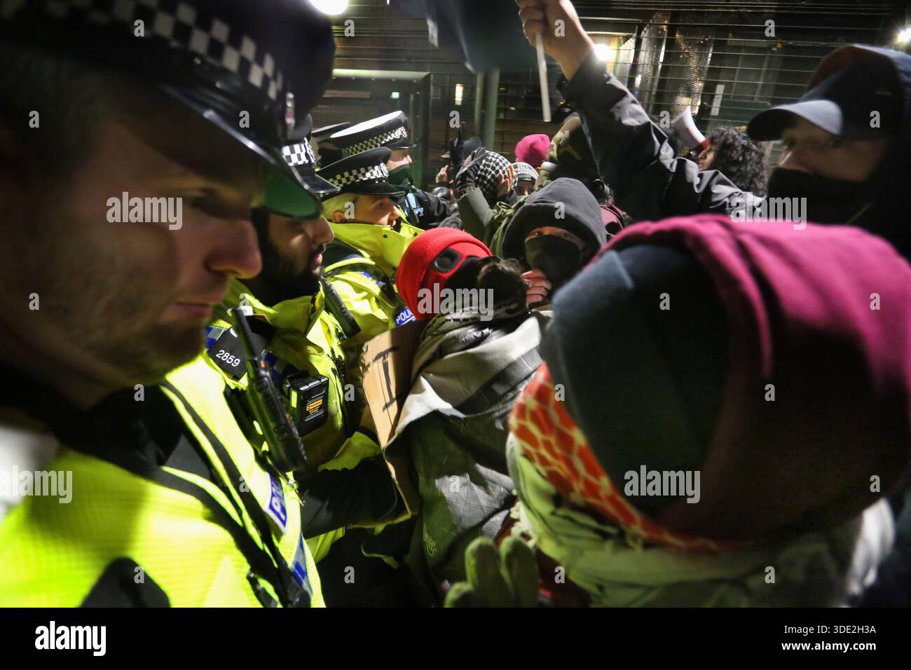 Police officers and protesters push one another during the ...