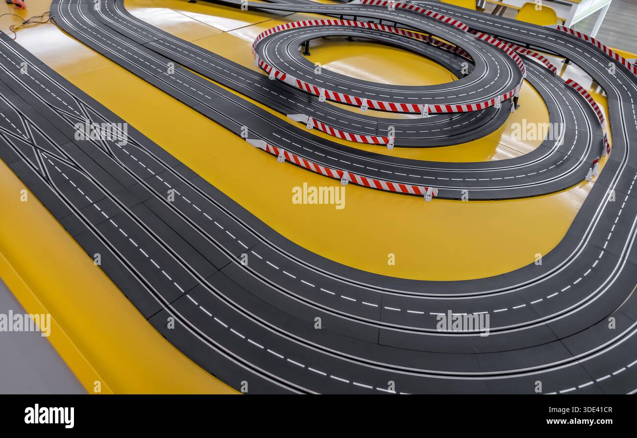 Miniature Racetrack Railing The toy race track. Miniature race cars on a race track. racing track ...