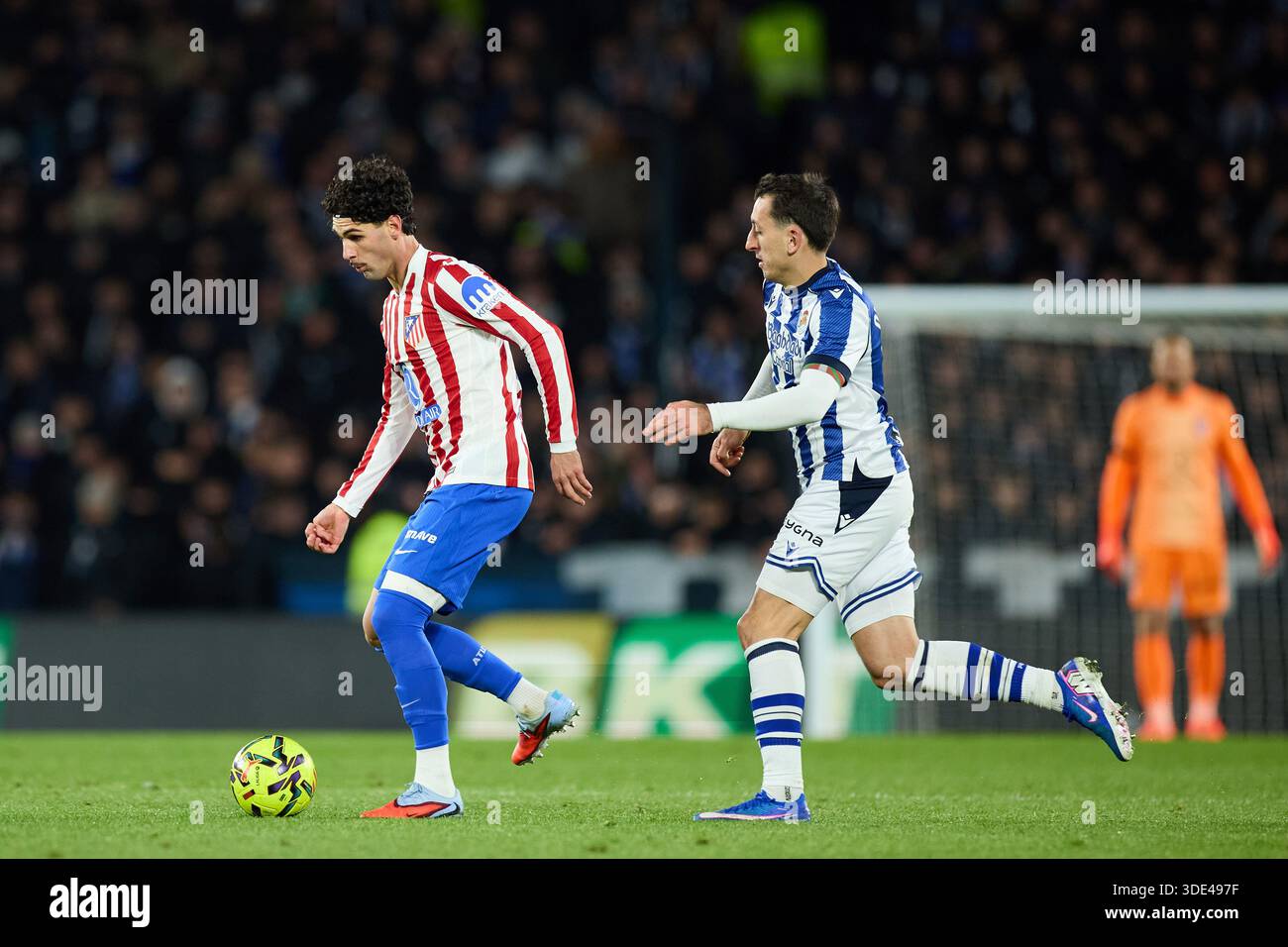 Johnny Cardoso of Atletico de Madrid and Mikel Oyarzabal of Real ...