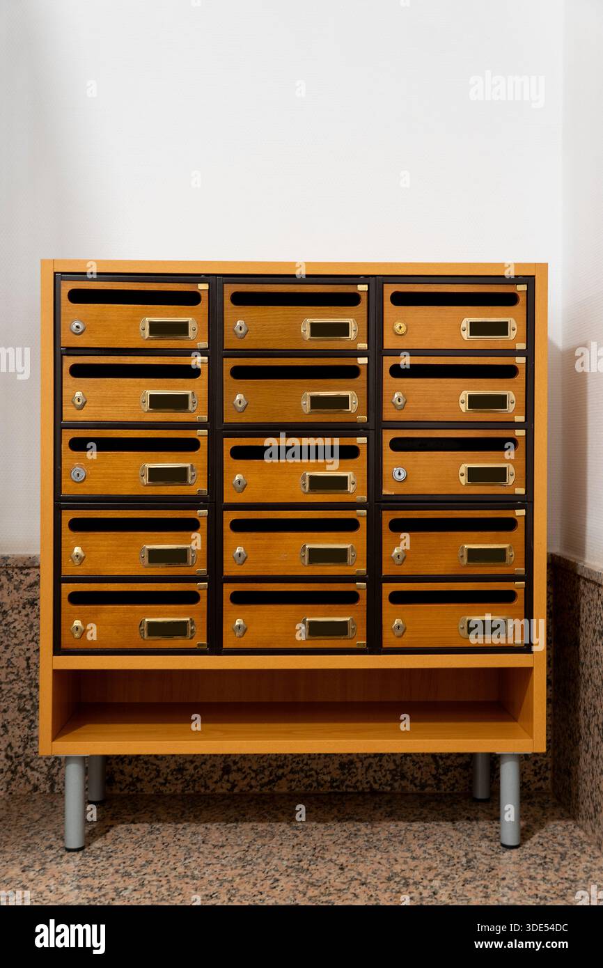Lock Methods Mailboxes in a residential building entrance, featuring wooden doors ...