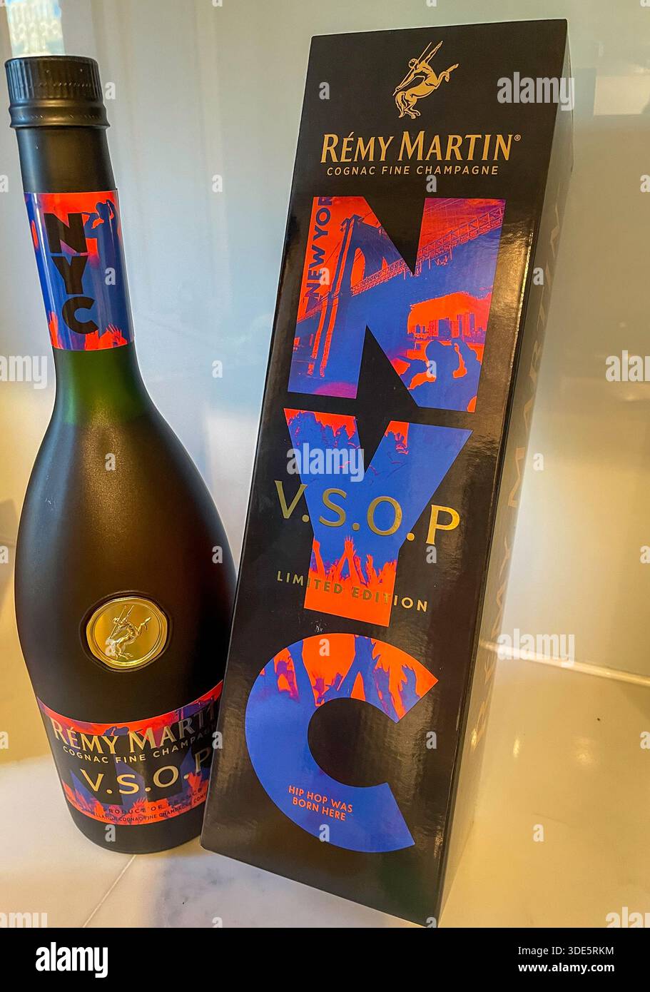 Still life of a Remy Martin VSOP cognac bottle and special NYC commemorative box, 2025, New York City, United States - Smartphone Captured Stock Image