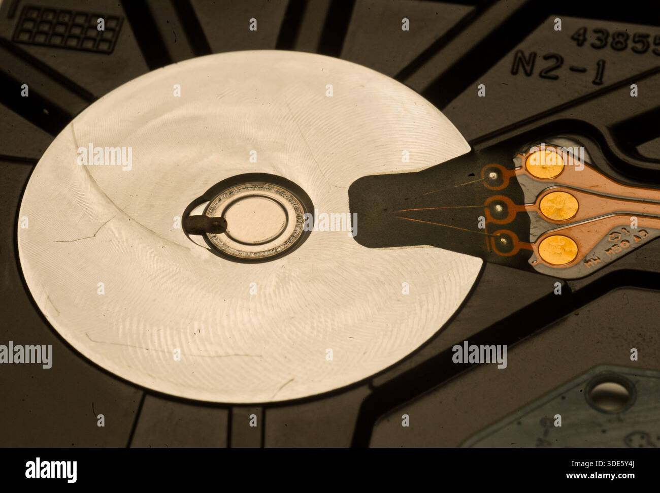 A damaged hard drive from an Apple computer. Stock Photo