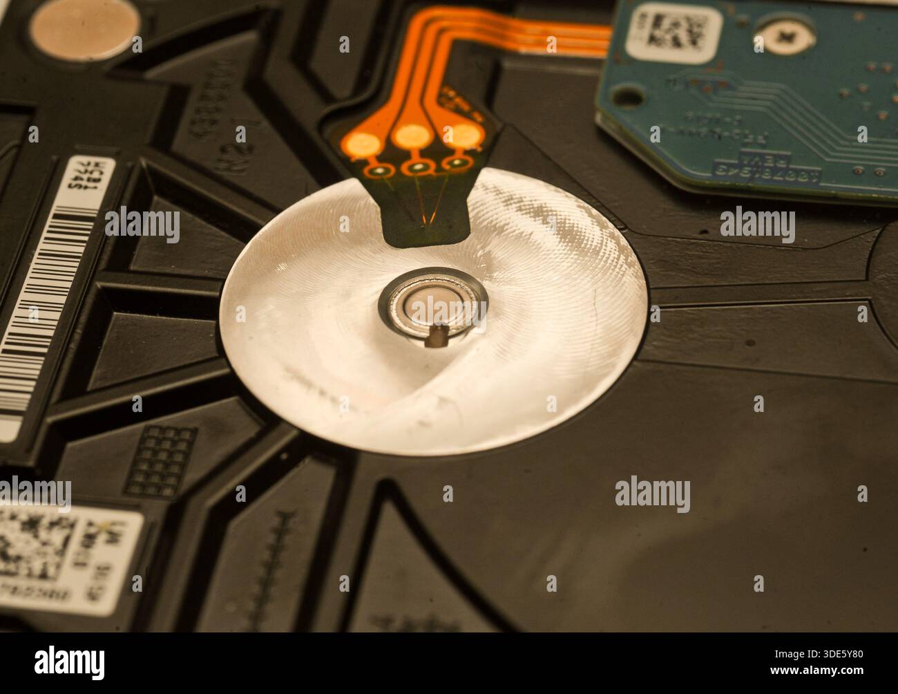 A damaged hard drive from an Apple computer. Stock Photo