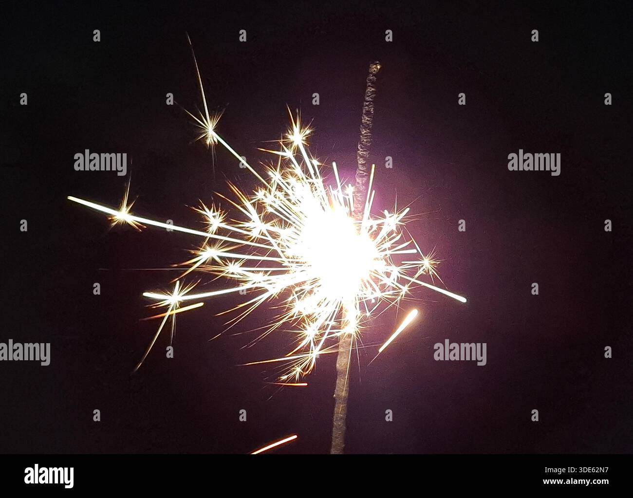 Burning sparkler on a black background Stock Photo