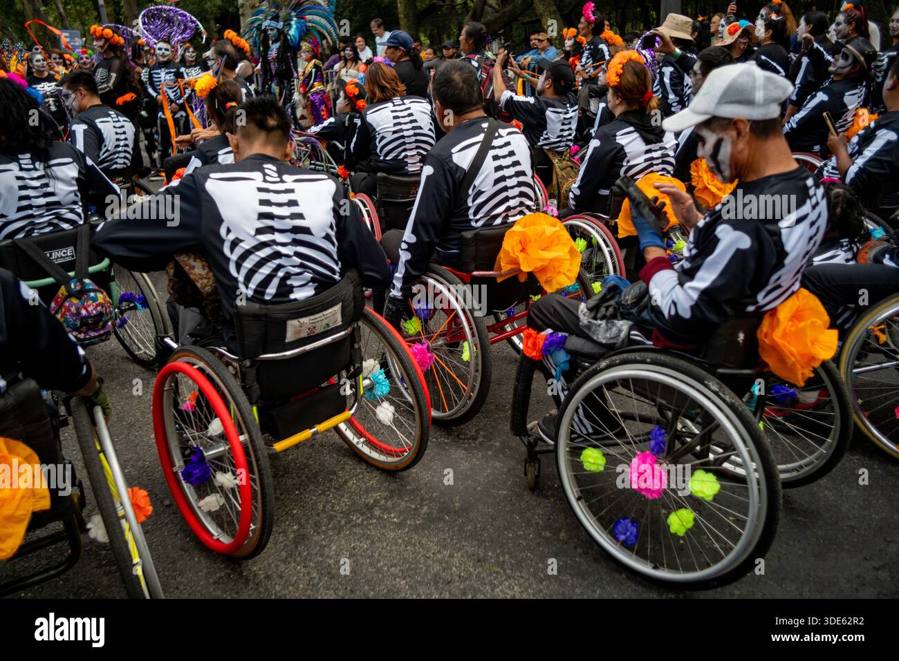 Participants in wheelchairs taking part in the Day of the Dead parade in Mexico City, Mexico. Stock Photo