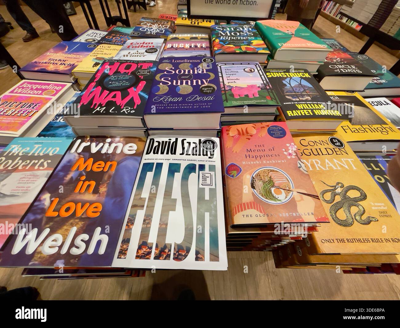 Selection of fiction books at the bookstore including Booker Prize Winner David Szalay with Flesh - Smartphone Captured Stock Image