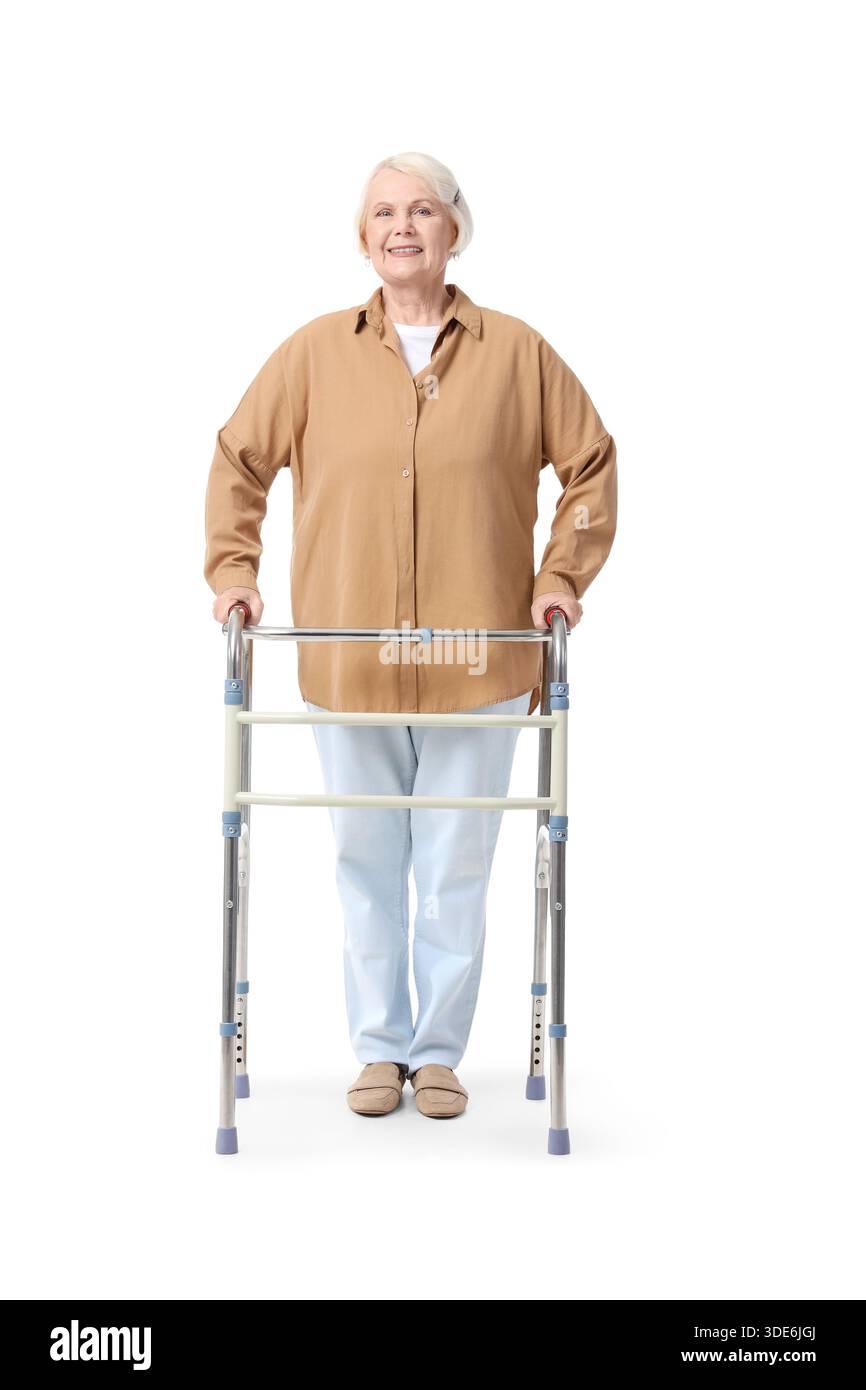 Senior woman with walker on white background Stock Photo - Alamy