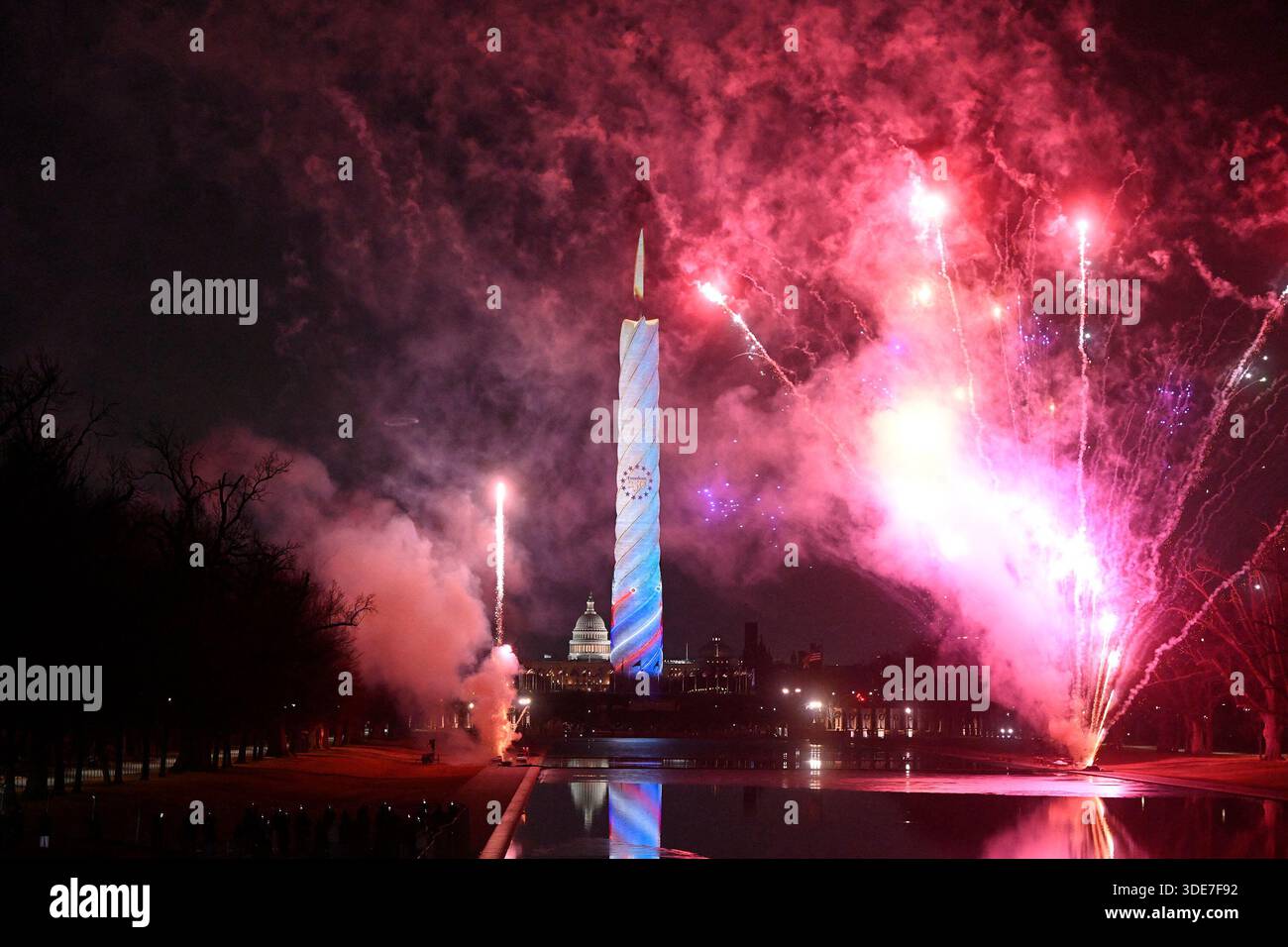 Fireworks erupt behind the Washington Monument during the United States