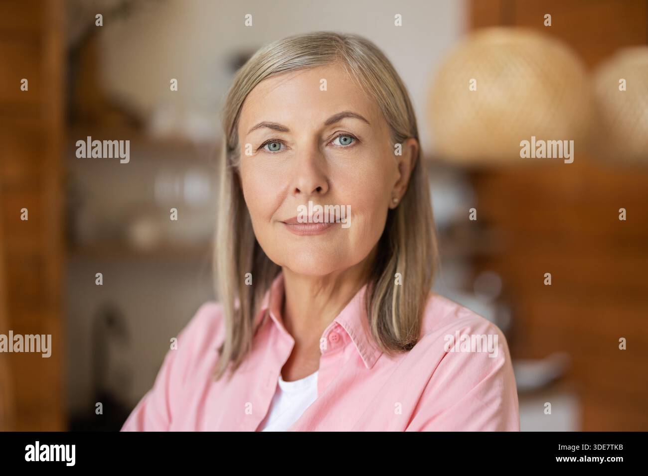 Elderly lady posing casually indoors with relaxed expression Stock Photo