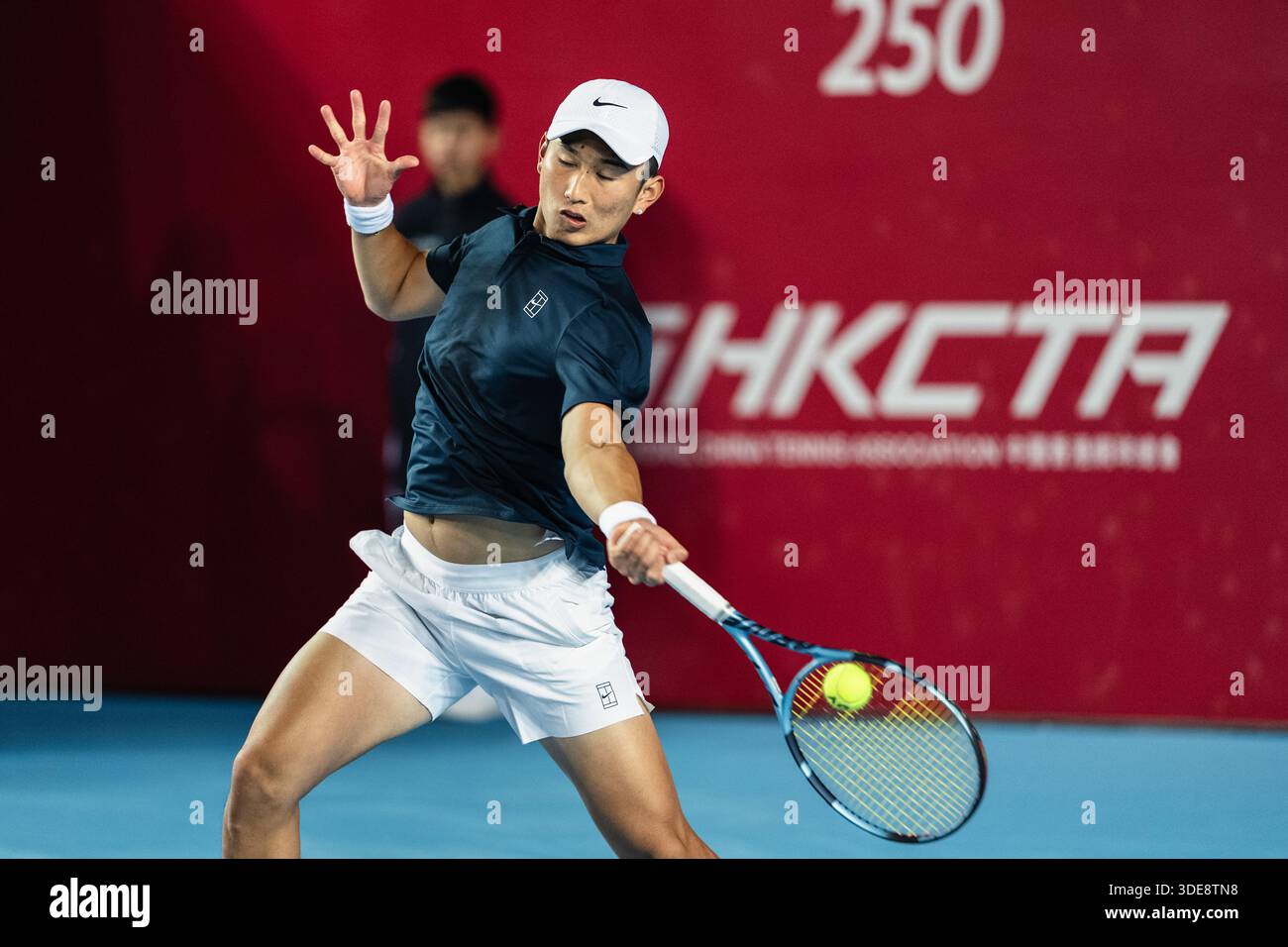 HONG KONG, China - JANUARY 06: Juncheng Shang of China hits the ball ...