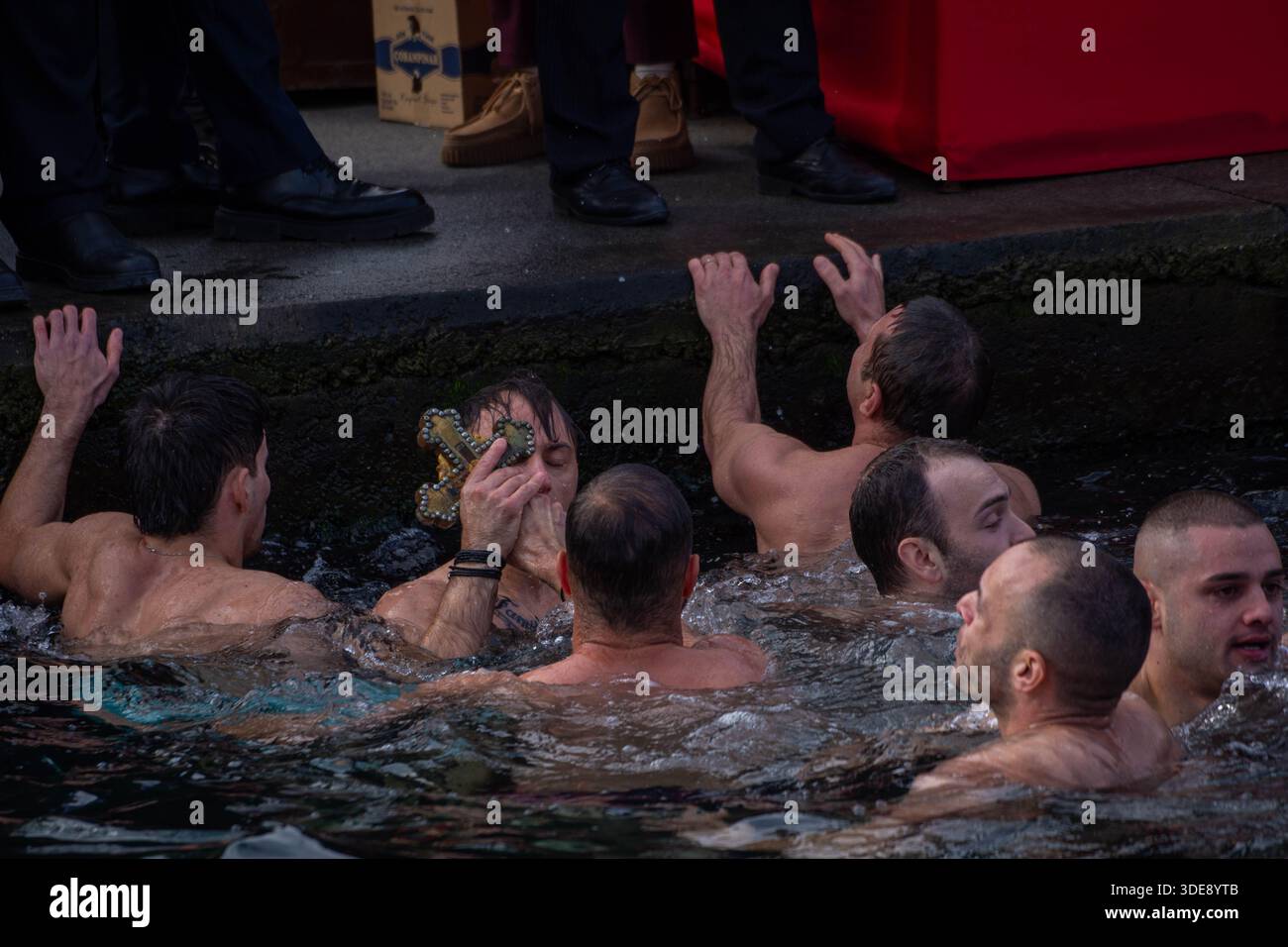 Istanbul, Istanbul, Turkey. 6th Jan, 2026. The traditional Cross Throwing Ceremony was held at the Ecumenical Patriarchate in Fener, located in Istanbul's Balat district. The ceremony, which symbolizes the baptism of Jesus Christ in the Jordan River according to Orthodox Christian belief, included prayers and the blessing of the waters by throwing a cross into the holy water.Ecumenical Patriarch Bartholomew attended the ceremony. Clergy members and worshippers also took part, offering prayers for peace, health, and well-being. The ceremony concluded after hymns and blessings. (Credit Imag Stock Photo
