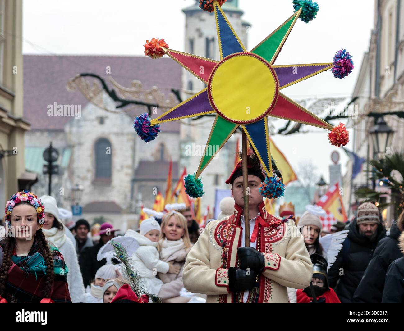 Krakow, Poland. 06th Jan, 2026. A man holds a symbolic star as crowd ...