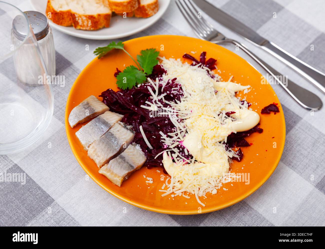 Beetroot served with cheese and pickled mackerel Stock Photo
