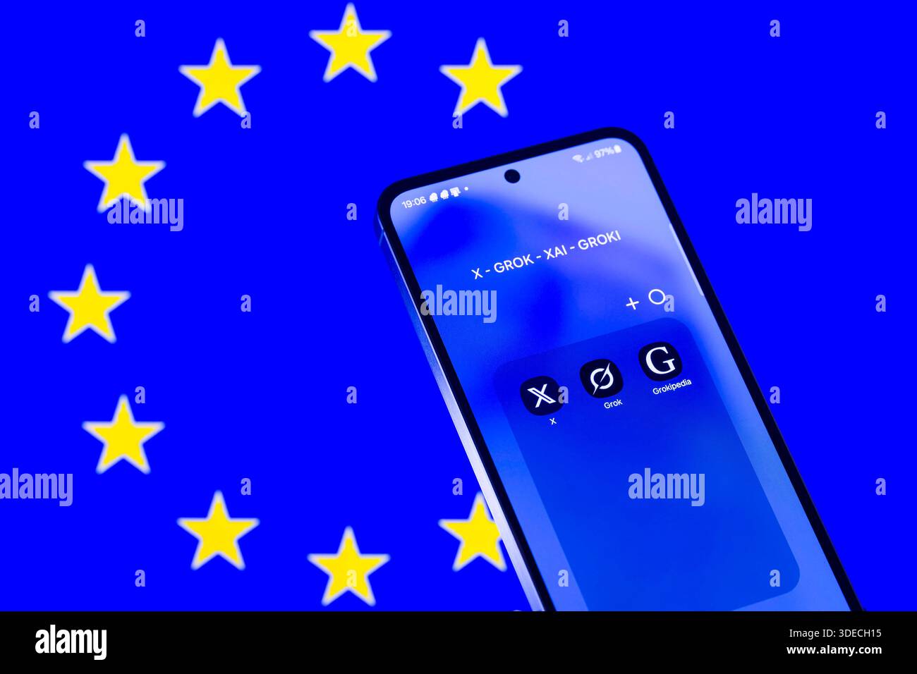 Brussels, Belgium. 06th Jan, 2026. The X - Grok - Grokipedia app icons is seen mobile phone with the EU flag visible seen in the background. In this photo illustration. Taken in Brussels, Belgium, on 6 January 2026. (Jonathan Raa/Sipa USA) *** Strictly for editorial news purposes only *** Credit: Sipa USA/Alamy Live News Stock Photo