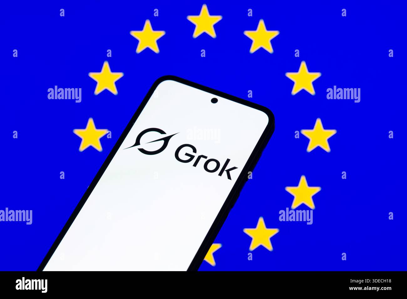 Brussels, Belgium. 06th Jan, 2026. The Grok logo is displayed on a mobile phone with the EU flag visible seen in the background. In this photo illustration. Taken in Brussels, Belgium, on 6 January 2026. (Jonathan Raa/Sipa USA) *** Strictly for editorial news purposes only *** Credit: Sipa USA/Alamy Live News Stock Photo