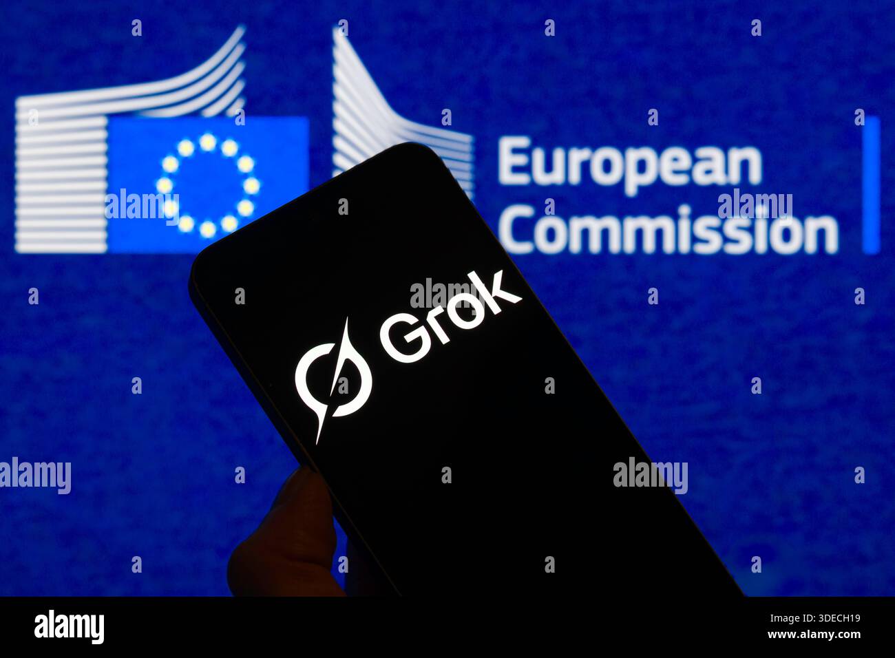 Brussels, Belgium. 06th Jan, 2026. The Grok logo is displayed on a mobile phone with the European Commission logo visible seen in the background. In this photo illustration. Taken in Brussels, Belgium, on 6 January 2026. (Jonathan Raa/Sipa USA) *** Strictly for editorial news purposes only *** Credit: Sipa USA/Alamy Live News Stock Photo