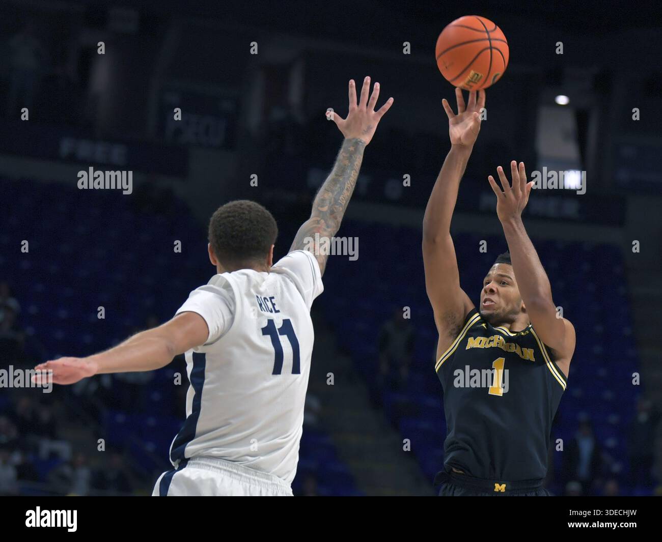 Trey Phillippi Rice Michigan's Trey McKenney (1) hits a 3-point shot over Penn State's Eli ...