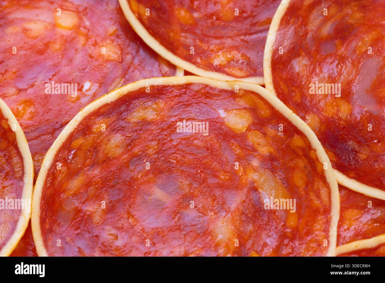 Topdown chorizo rounds on platter creating repeating pattern ...