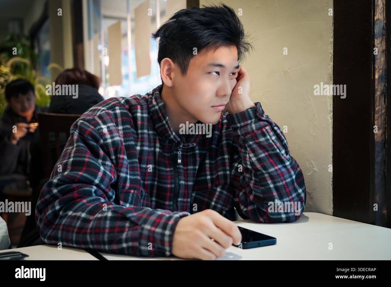 Young asian man having stressful time Stock Photo