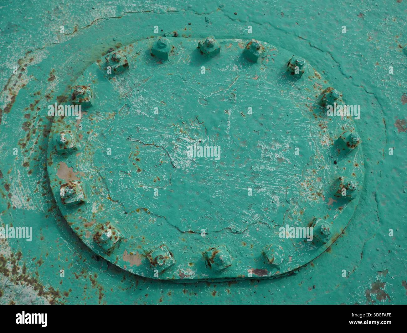 Heavy duty metal utility access panel painted green Stock Photo