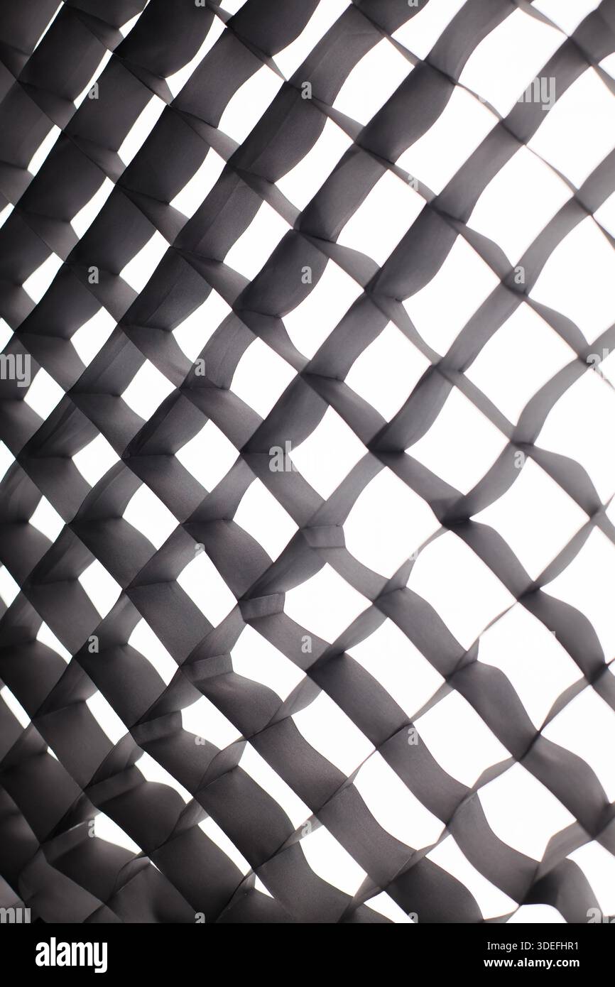 Fabric honeycomb for softbox. Abstract softbox grid pattern with light and shadow, geometric texture background. Stock Photo