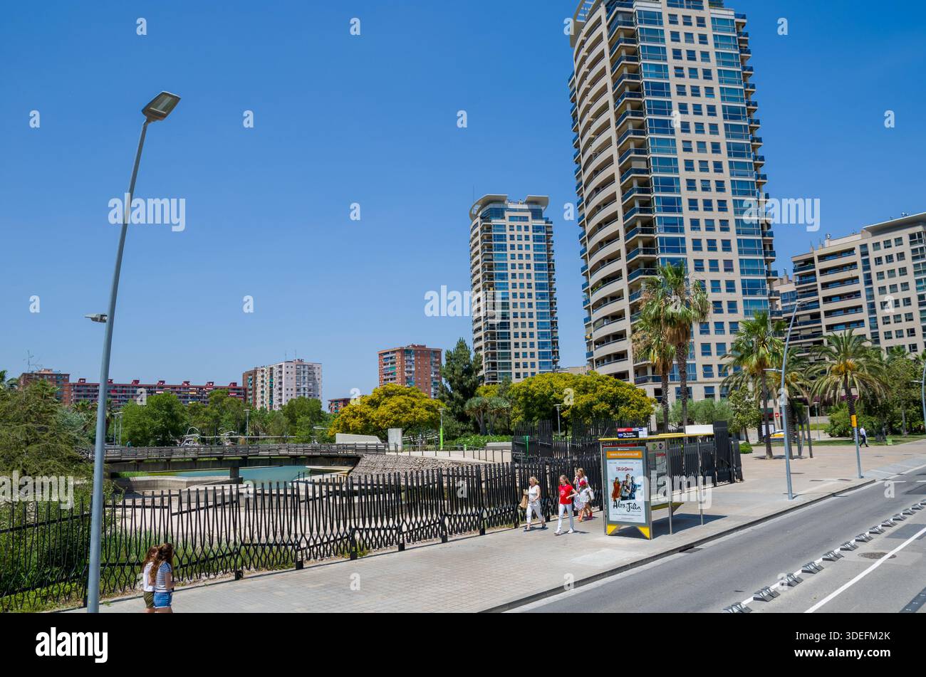 Urban street scene with modern high-rise buildings and pedestrians ...
