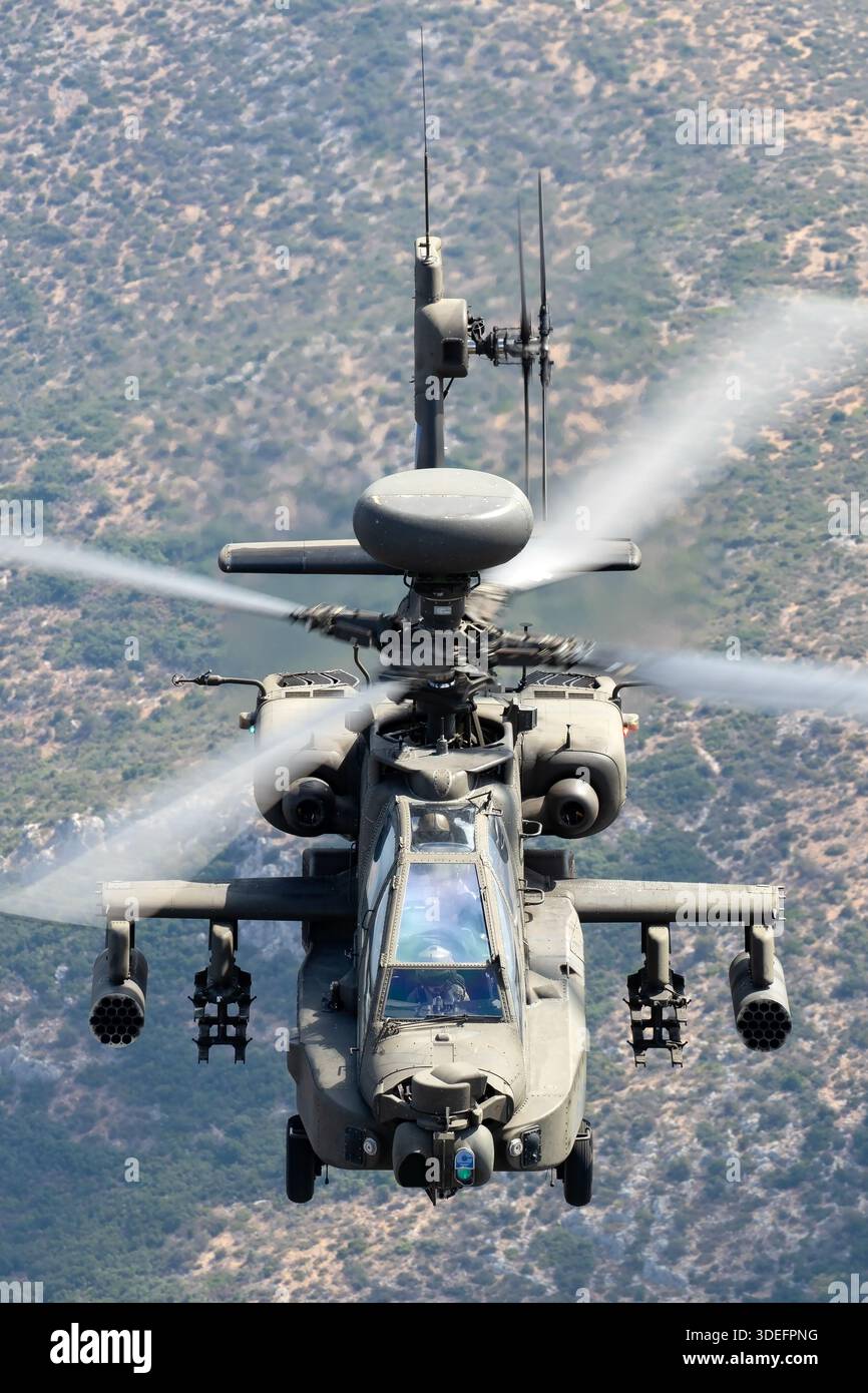 The image depicts a Hellenic Army AH-64DHA Apache Longbow in flight at ...