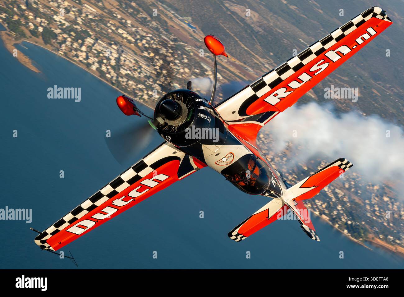 The image shows a Dutch Rush Aerobatics Sukhoi Su-26MX single-seat ...