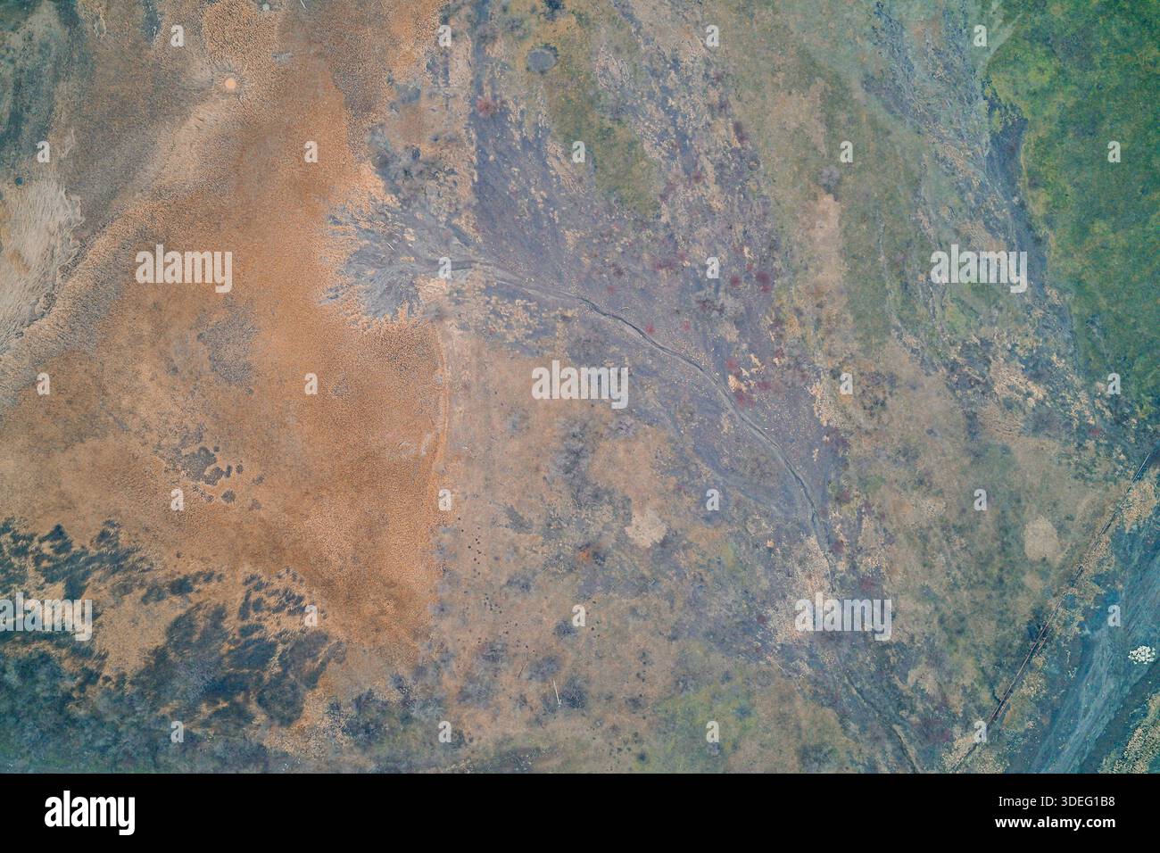 Aerial top-down view of a textured landscape featuring an alluvial fan ...