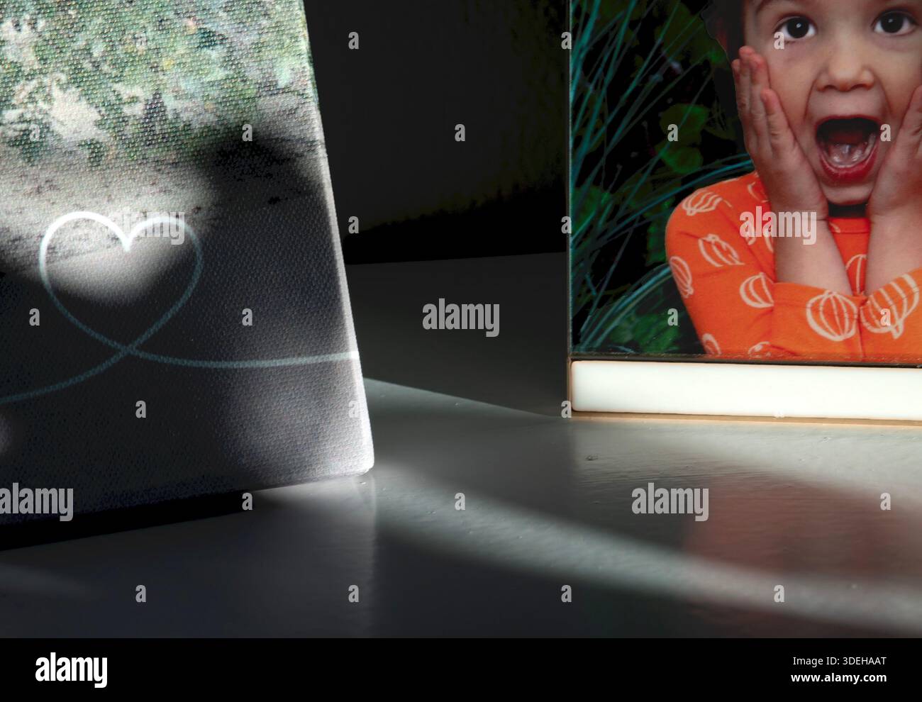 A child expresses surprise in a photo Stock Photo