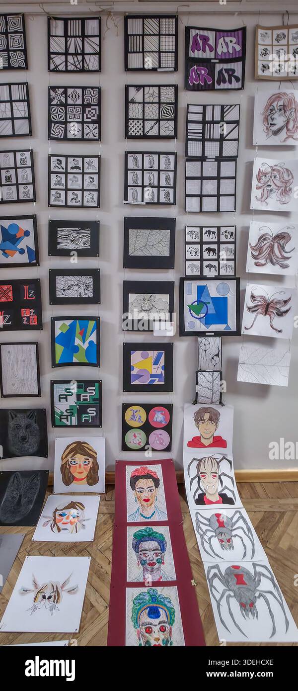 January 06, 2026, Latvia. University art students exam - artworks exhibition. Art paintings, hanging on the wall Stock Photo