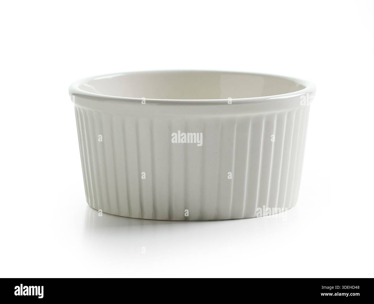 new empty small baking cup isolated on white background Stock Photo