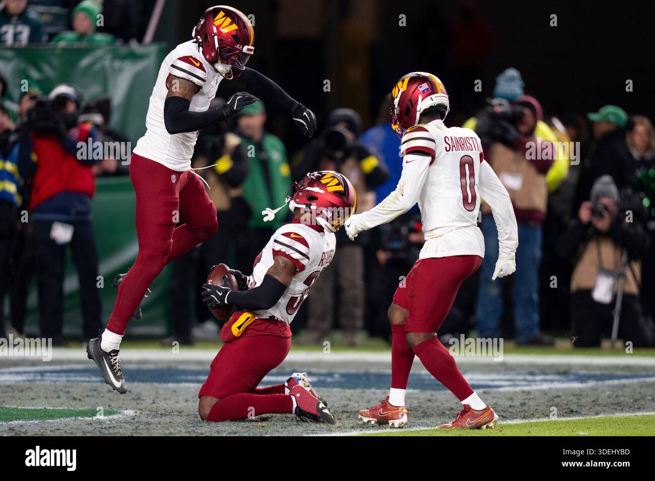 Washington Commanders safety Jeremy Reaves celebrates the interception ...