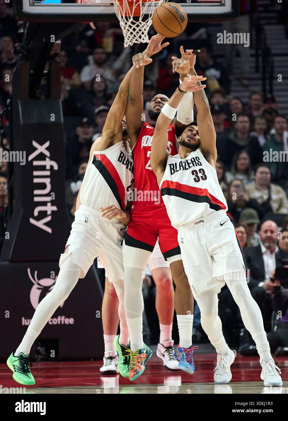 Houston Rockets guard Josh Okogie, center, fights for the ball with ...