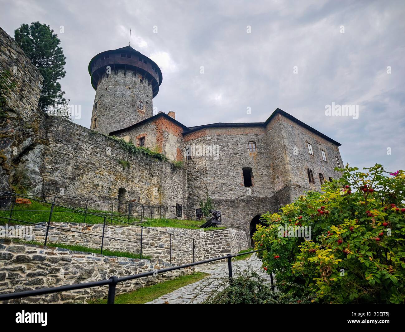 Exterior view of a medieval stone castle with tall towers and ...