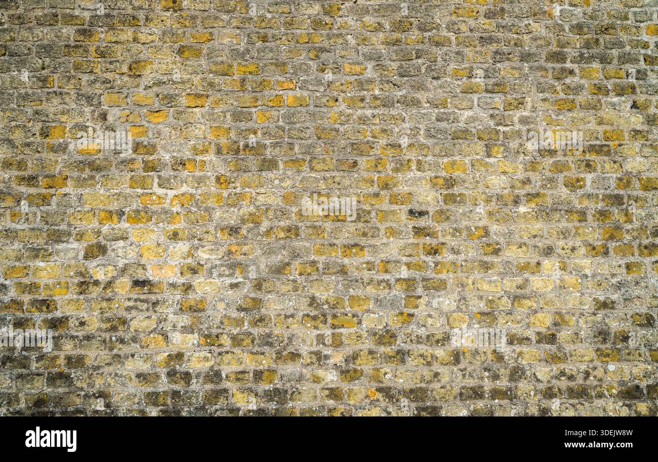 Rustic wall in beige-brown tones. Brick wall as a background. Stock Photo