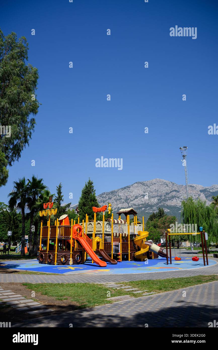 Children's playground with variety of outdoor play structures. Colorful ...