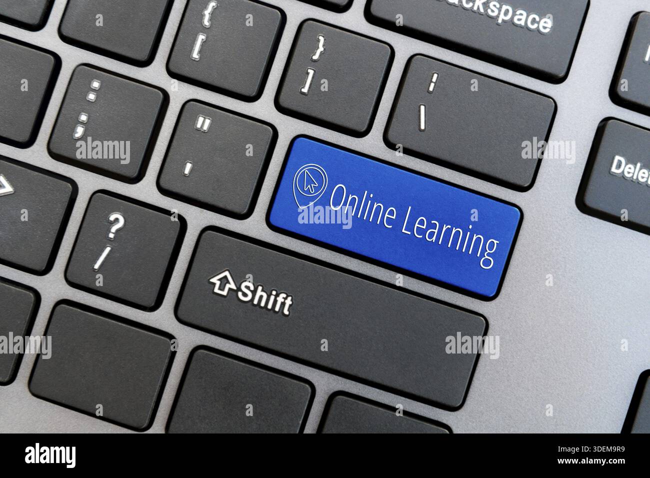Computer keyboard with computer cursor icon and word Online Learning on blue enter button. Online education concept Stock Photo