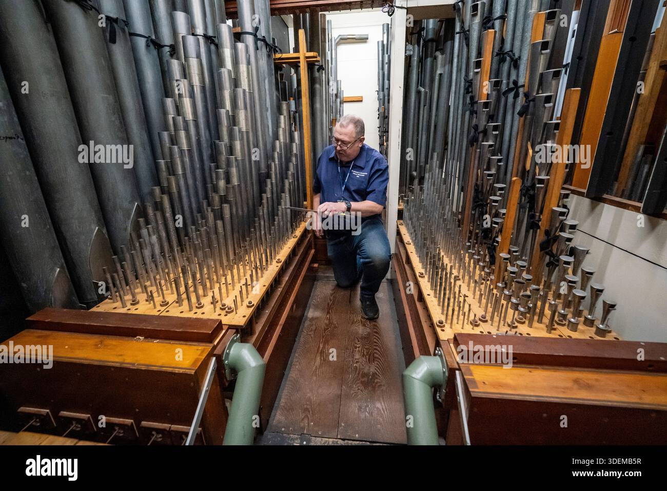 Harrison & Harrison organ technician Stephen Alliss uses a reed knife ...