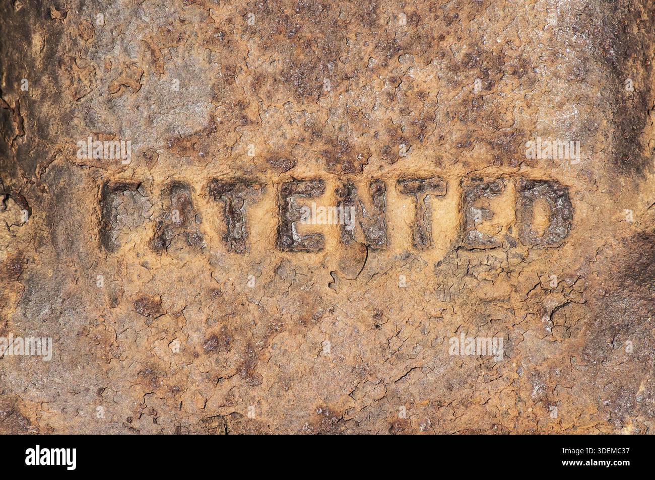 Old weathered rusty cast iron surface labeled Stock Photo