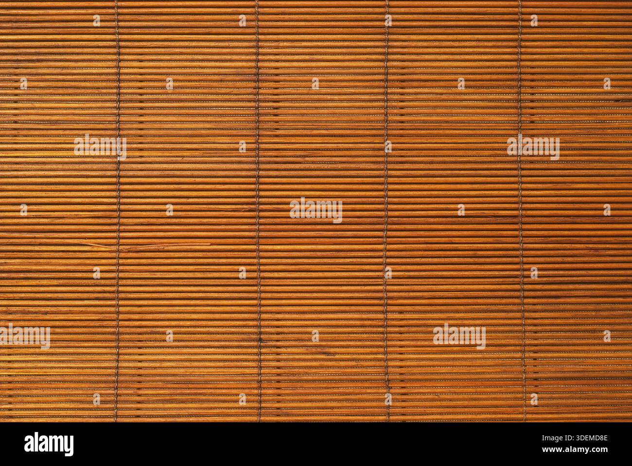 Brown reed mat texture closeup as background Stock Photo