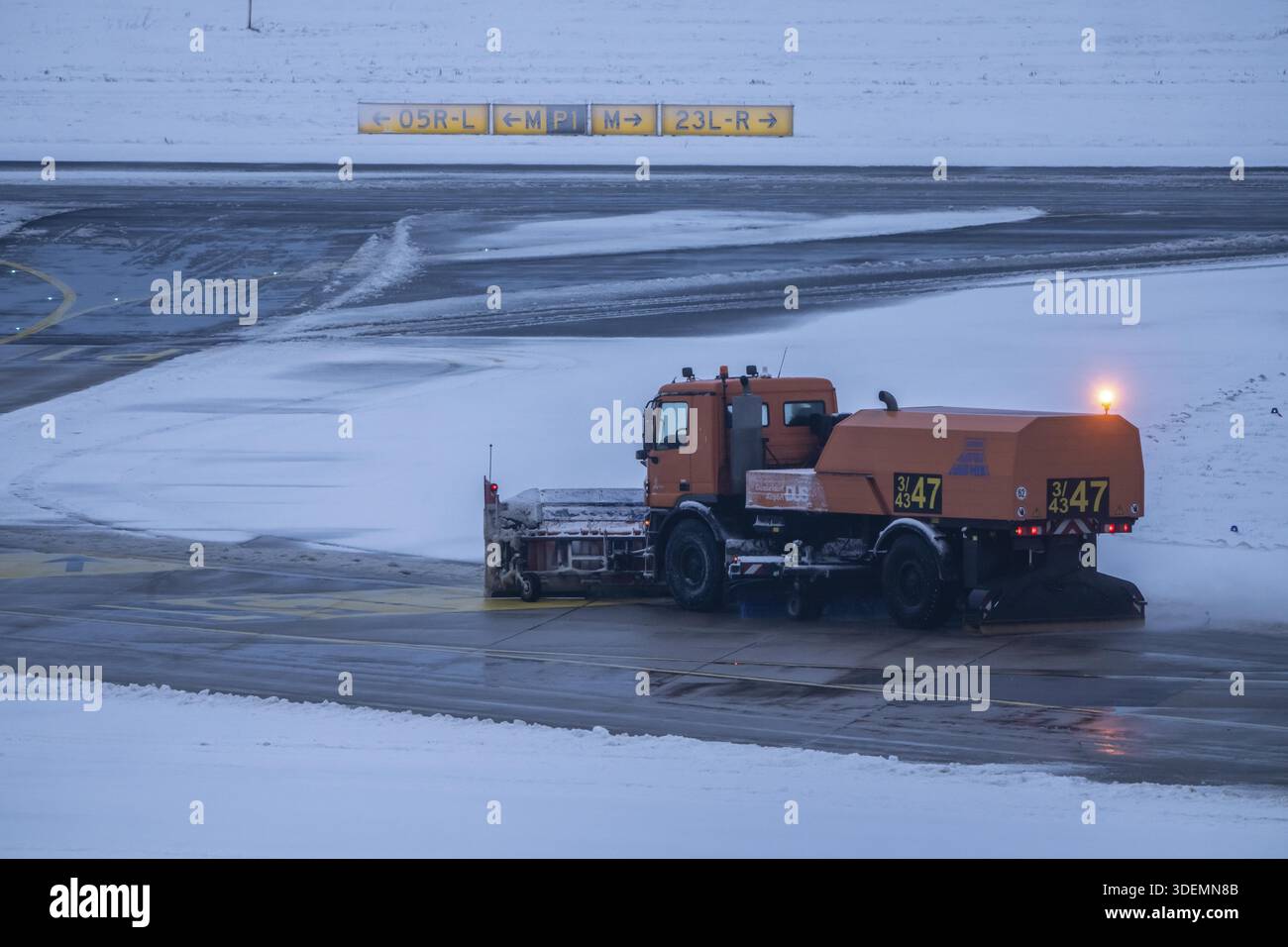The onset of winter in North Rhine-Westphalia, flight operations were maintained at Duesseldorf airport with great effort, taxiways, runway were freed Stock Photo