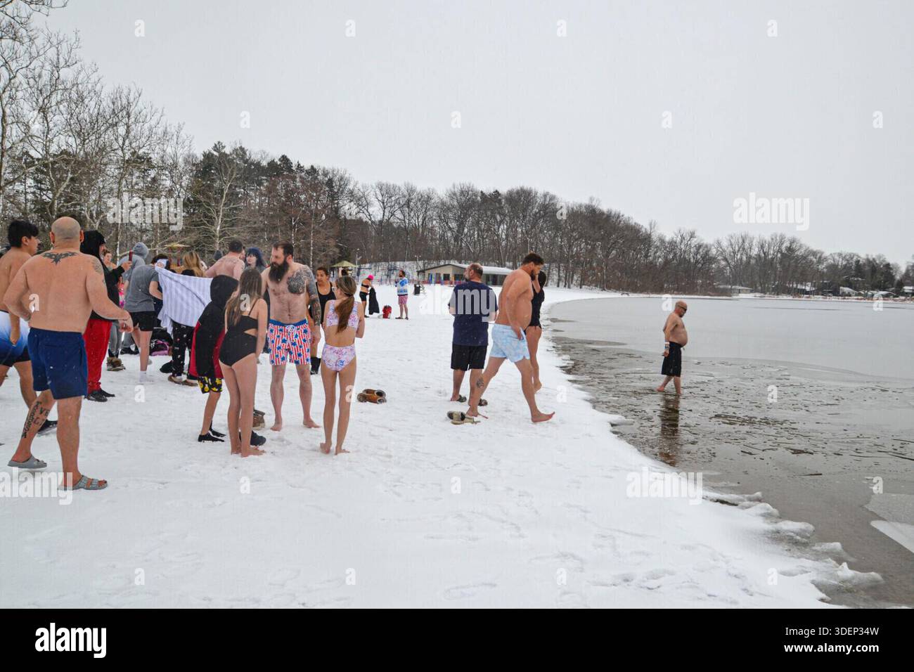 New Year's Day Polar Plunge participants prepare to dash into Stone ...