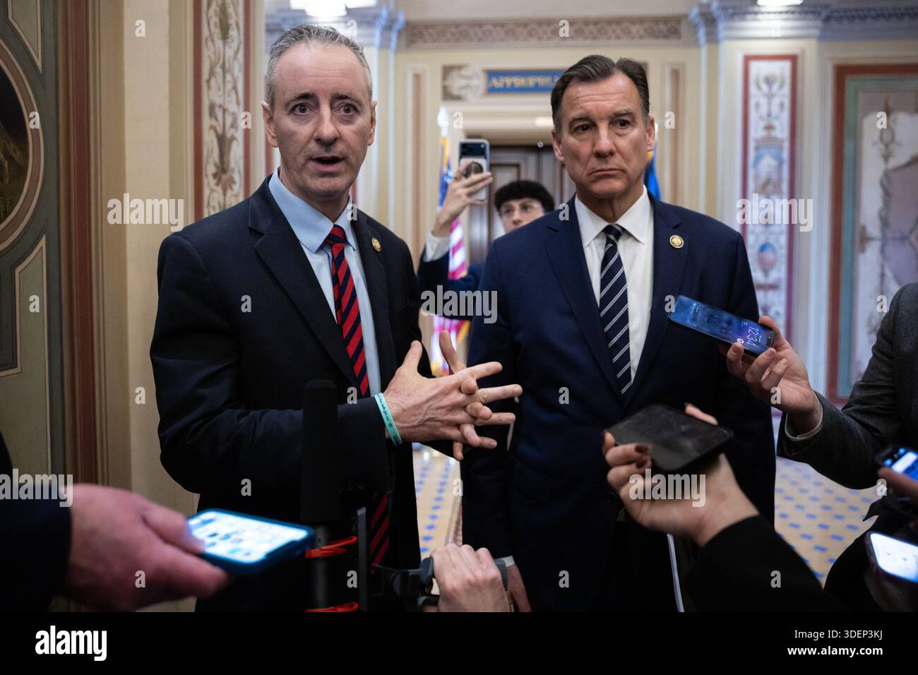 Reps. Brian Fitzpatrick (R-Pa.) and Tom Suozzi (D-N.Y.) speak with ...