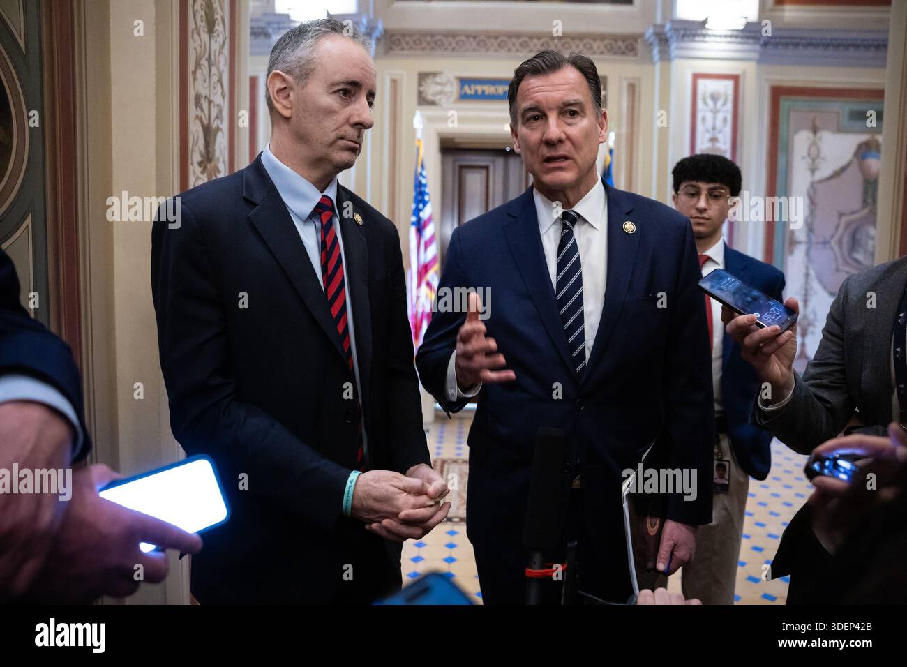 Reps. Brian Fitzpatrick (R-Pa.) and Tom Suozzi (D-N.Y.) speak with ...