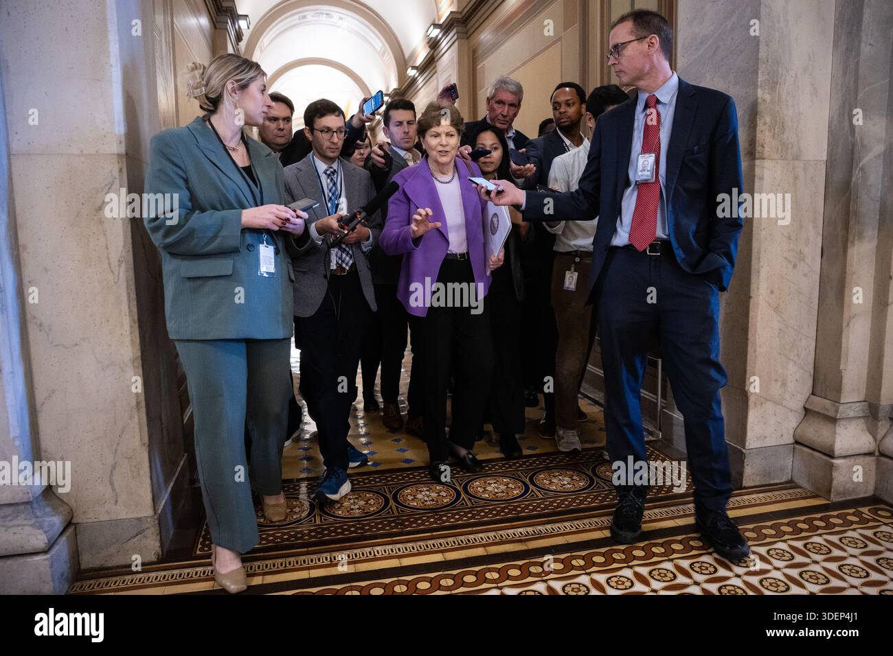 Sen. Jeanne Shaheen (D-N.H.) speaks with reporters as she emerges from ...