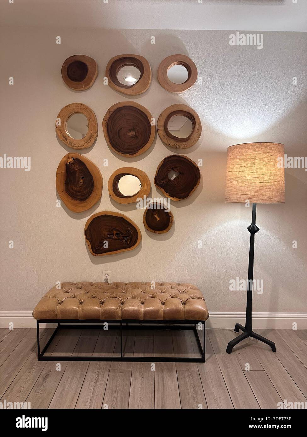 Modern Hotel Interior with Organic Wood Wall Art and Leather Bench - Smartphone Captured Stock Image