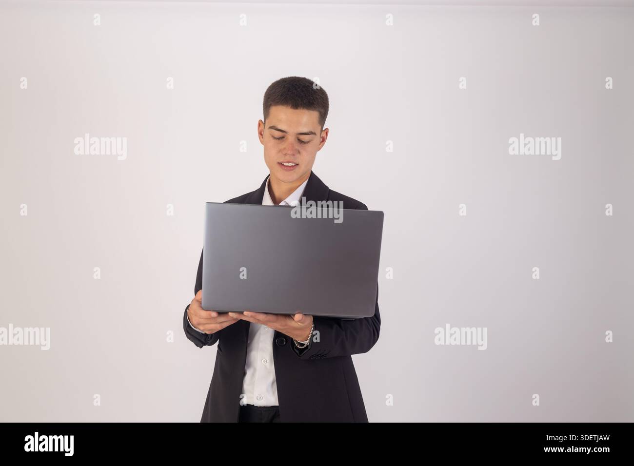 Businessman using laptop computer in suit Stock Photo