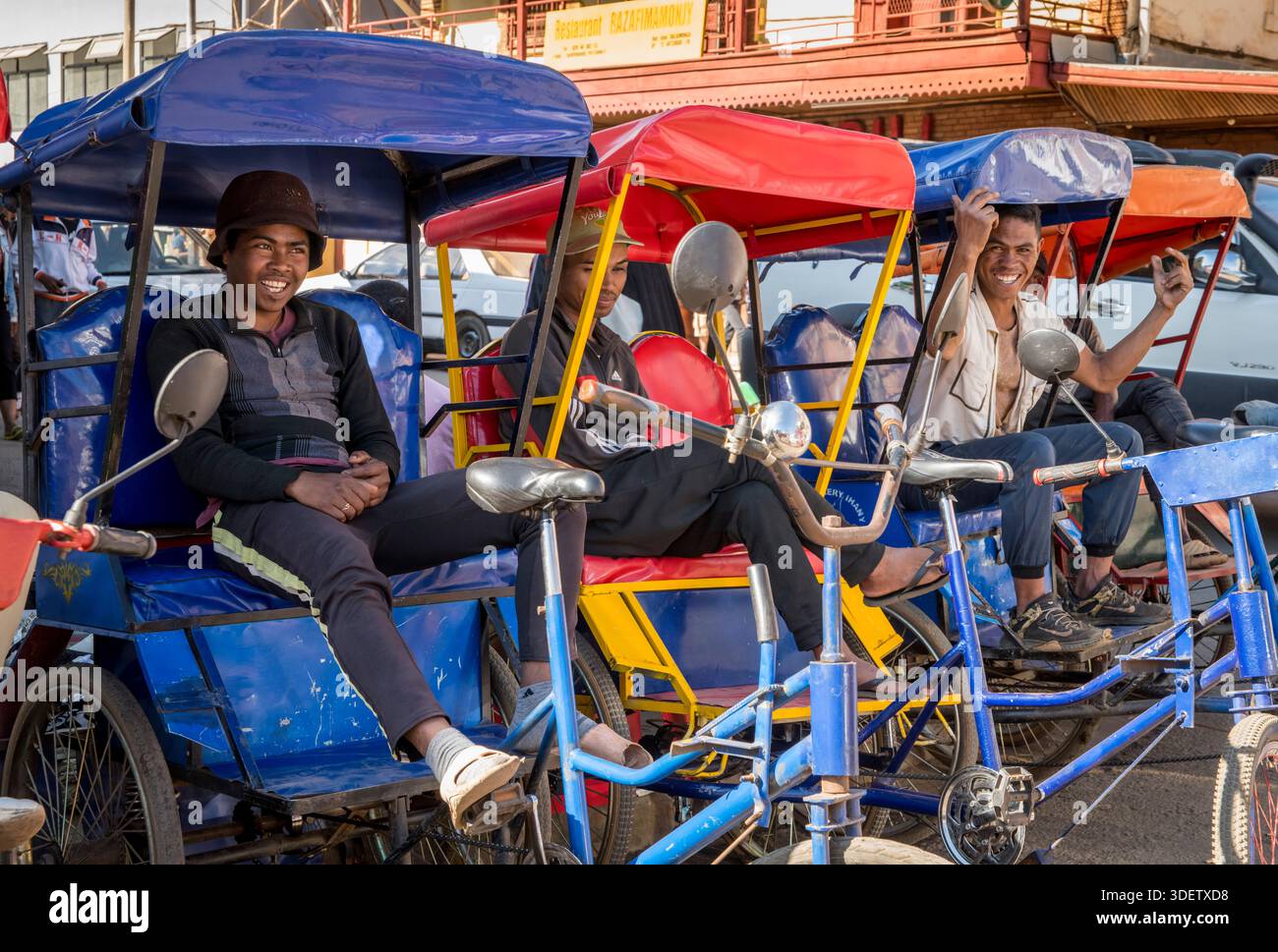 A group of cycle rickshaw drivers and their colorful cycle rickshaws ...